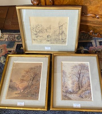 three framed pictures of trees and a house on a rug