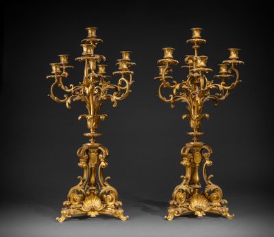 a pair of gilded bronze candelabs