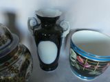 three vases sitting next to each other on a table