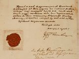 un vieux document portant un cachet de cire et un timbre