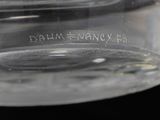 a close up of a clear glass container with a label on it