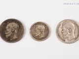 three different types of coins are shown on a white surface