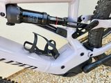 a close up of a bike with a bottle holder attached to it