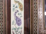 a picture of a picture of birds and flowers on the wall