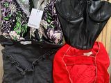 three women ' s bra tops, one black, one red, and one black