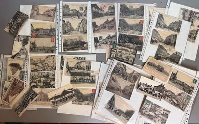 a lot of old postcards sitting on a table