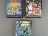 three video games are sitting on a table next to each other