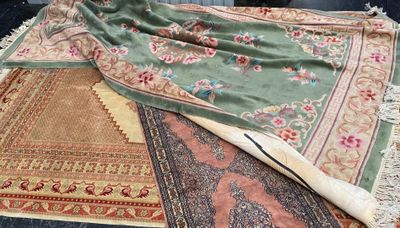 many different rugs laid out on the floor