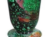 a vase with a green and red design on it