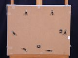 a picture of a picture on a easel with magnets attached to it