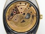 an image of a close up of a watch on a white surface