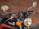 a motorcycle that is parked in front of a brick wall
