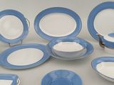 a table with a lot of blue and white plates and bowls