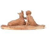 a statue of a boy and a girl sitting on a piece of wood