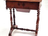 an old wooden table with a drawer on top of it