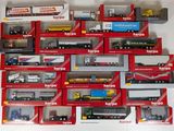many different types of toy trucks in the box