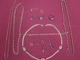 a lot of jewelry that is laying out on a table
