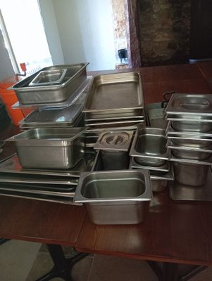 many pans on the table ready to be cooked
