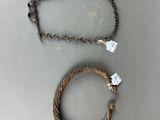 two pieces of rope that are attached to a chain