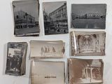 several old black and white photos of people and buildings on a white surface