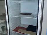 an image of an empty refrigerator in a room