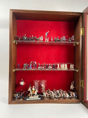 a display case with a lot of toy soldiers in it