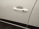 a door handle on a white car with a black stripe