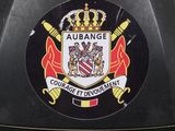 the back of a black motorcycle with a badge on it