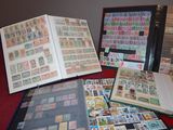 many different types of stamps on a book on a table
