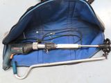 a blue bag with tools inside of it on the floor