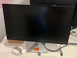 two laptops and a monitor on a table