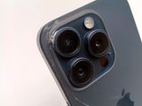 the rear view of an iphone 11 with three camera lenses on it