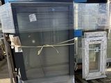 several different types of windows are stacked on a pallet