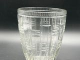 a glass cup that is sitting on a table