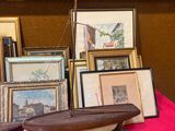 a table with a red table cloth and a bunch of pictures on it