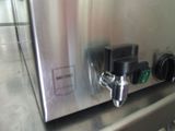 an image of a stainless steel counter top with a water dispenser attached to it