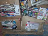 a cardboard box full of school supplies on the floor