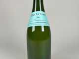 a bottle of wine that is sitting on a table