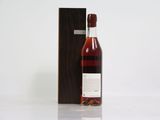 an image of a bottle of wine sitting next to a wooden box