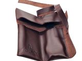 a close up of a brown leather bag on a white background
