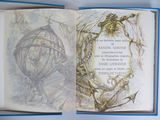 un livre ouvert sur lequel est dessiné un oiseau en cage
