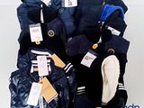 a pile of clothing that is on display on a table