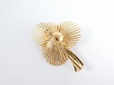 yellow gold plated brooch pin with a sunburst design