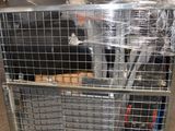 a metal cart with a bunch of items in it