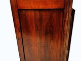 a small wooden cabinet with a drawer on top of it