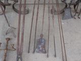 a lot of old tools that are laying out on the ground