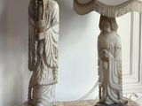 two lamps that are on a table in a room