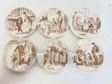 six assiettes marron et blanches ornées d'illustrations représentant des personnes et des animaux