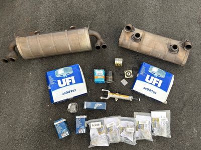 the contents of a car are laid out on the ground