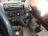 a close up of a car dashboard with a steering control